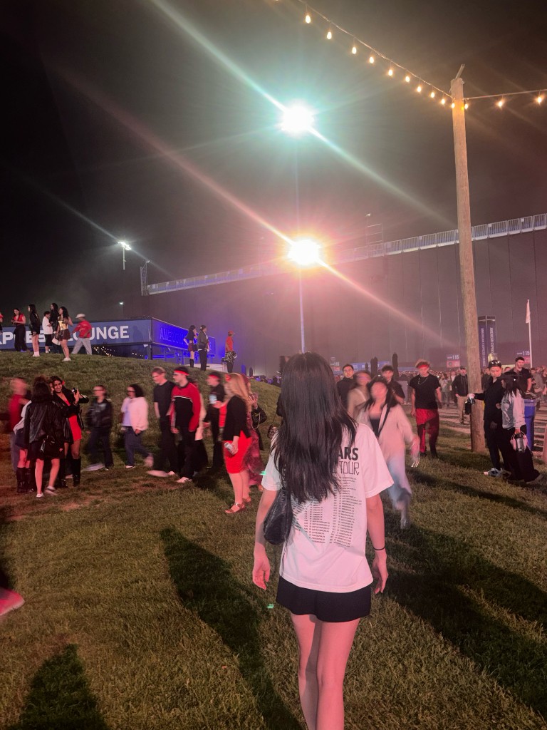 Hajeong Hwang at a Bruno Mars concert wearing a Mars Tour shirt